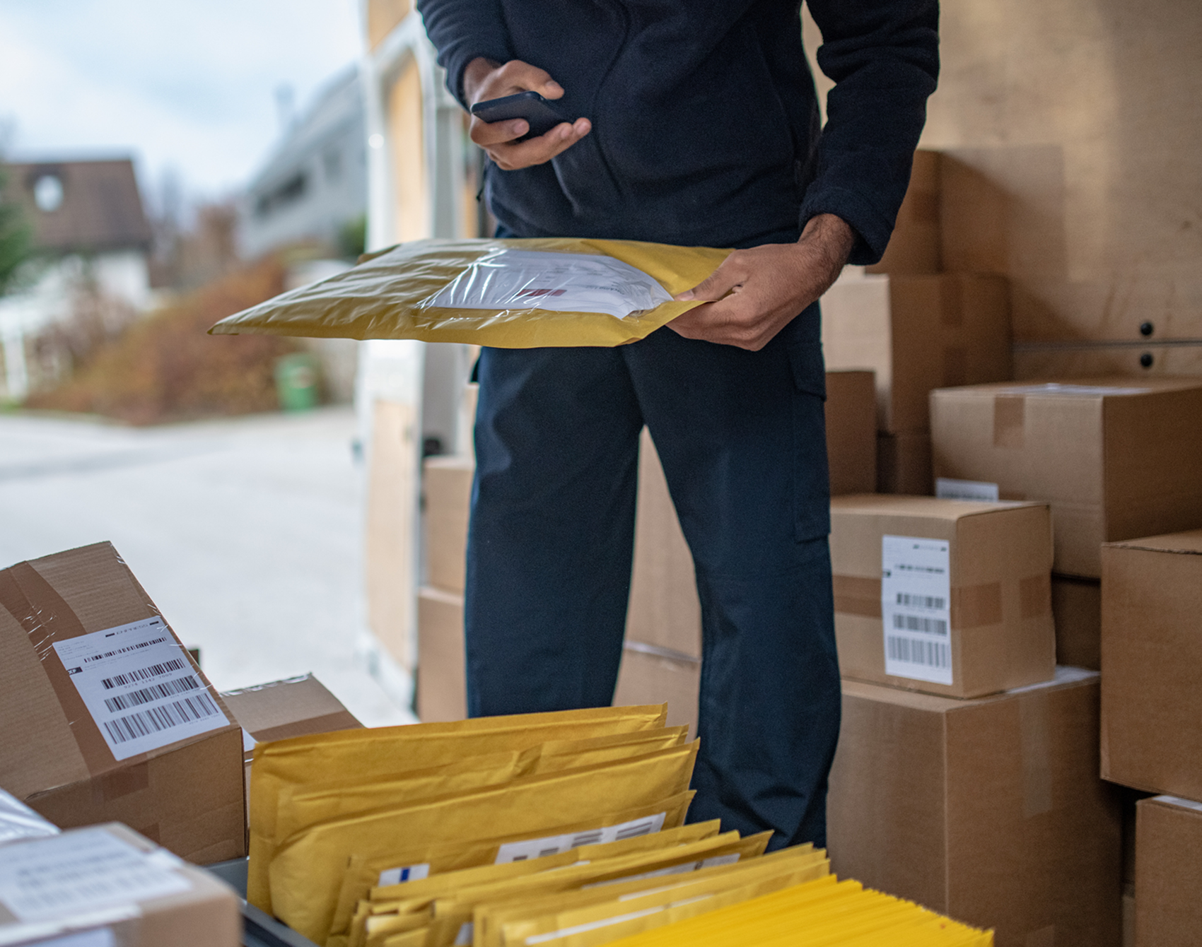 Delivery worker organizing parcels