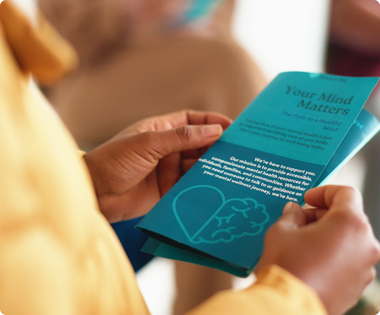 Close-up of hands with a health flyer
