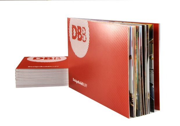 Opened and closed red brochures displayed