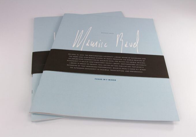 Two booklets with black wraps