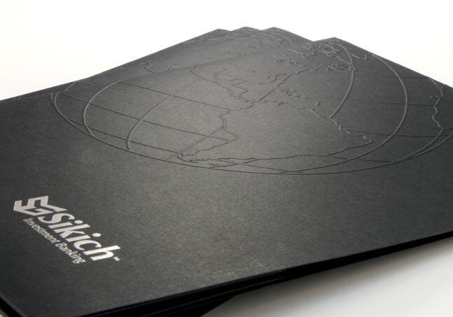 Professional black folder with subtle globe embossing.